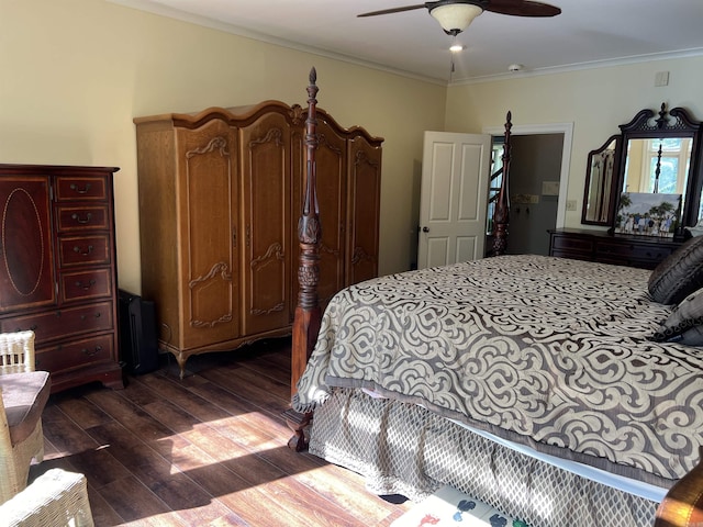 bedroom with ornamental molding, dark wood-style flooring, and a ceiling fan