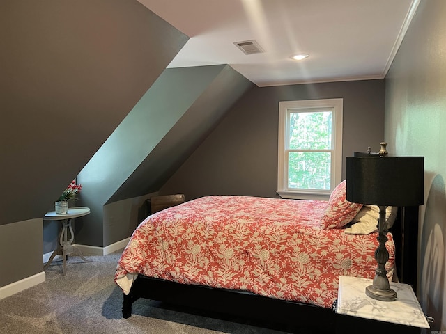 bedroom with visible vents, baseboards, vaulted ceiling, carpet, and crown molding