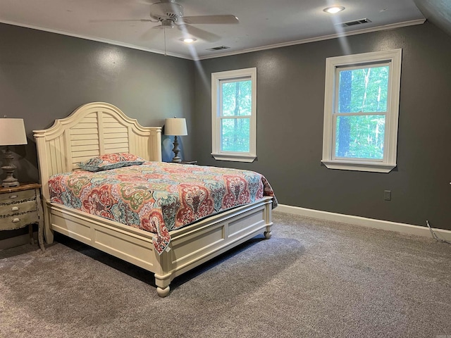 bedroom with carpet, visible vents, ornamental molding, and baseboards