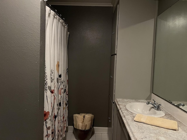 full bathroom featuring baseboards, tile patterned flooring, vanity, and a shower with curtain