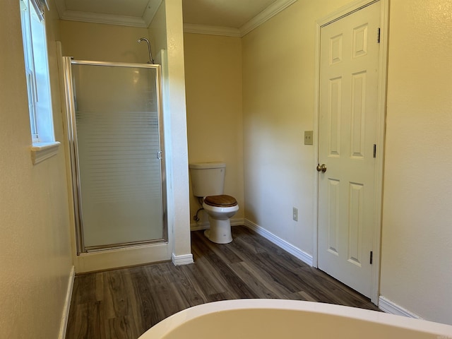 bathroom featuring a stall shower, baseboards, toilet, ornamental molding, and wood finished floors