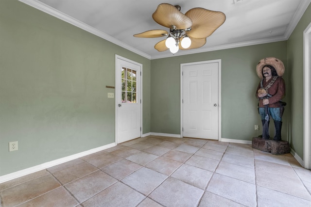 interior space with ornamental molding, light tile patterned floors, baseboards, and a ceiling fan