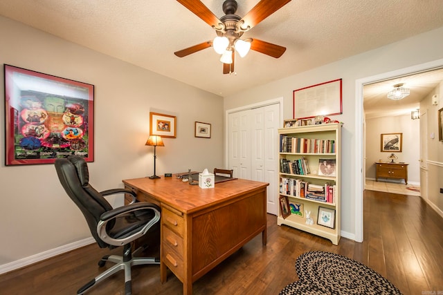 office space with ceiling fan, a textured ceiling, and dark hardwood / wood-style floors