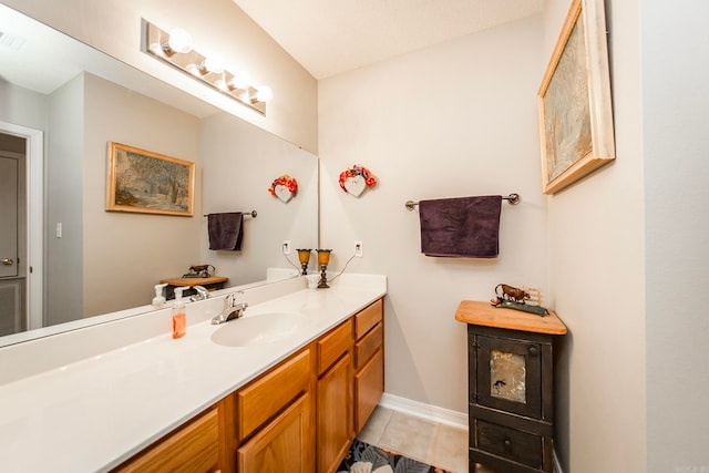 bathroom featuring tile patterned floors and vanity