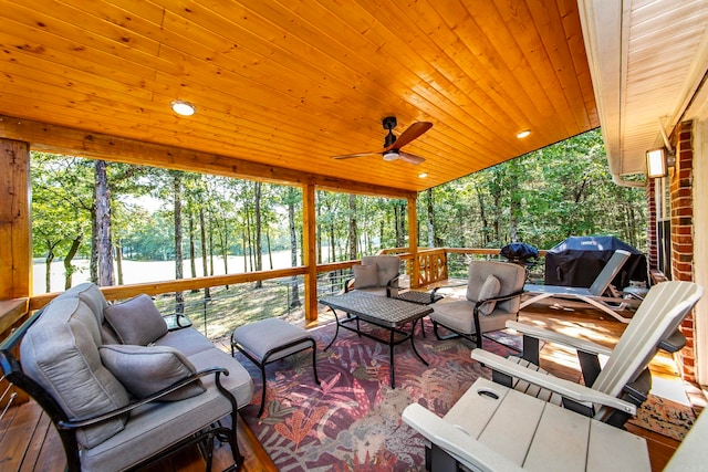 exterior space with ceiling fan, wood ceiling, and plenty of natural light