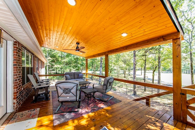 wooden deck with ceiling fan and an outdoor hangout area