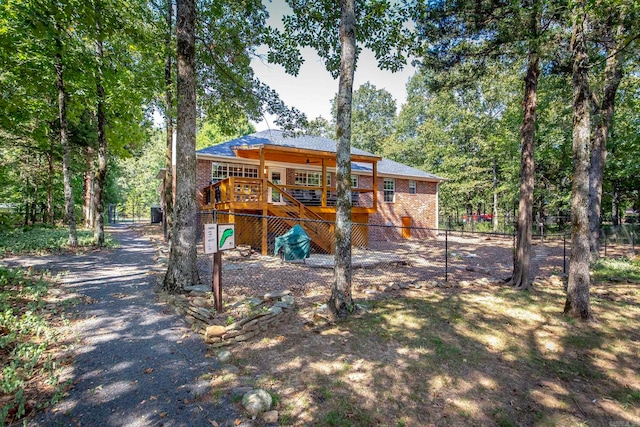 view of front of property with a wooden deck