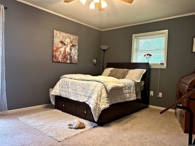 carpeted bedroom featuring ceiling fan and ornamental molding