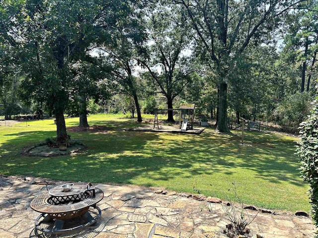 view of yard with a patio and a fire pit