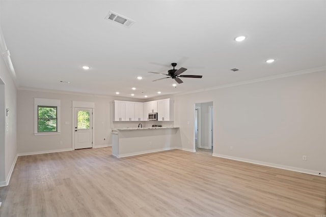 unfurnished living room with light wood-type flooring, crown molding, and ceiling fan