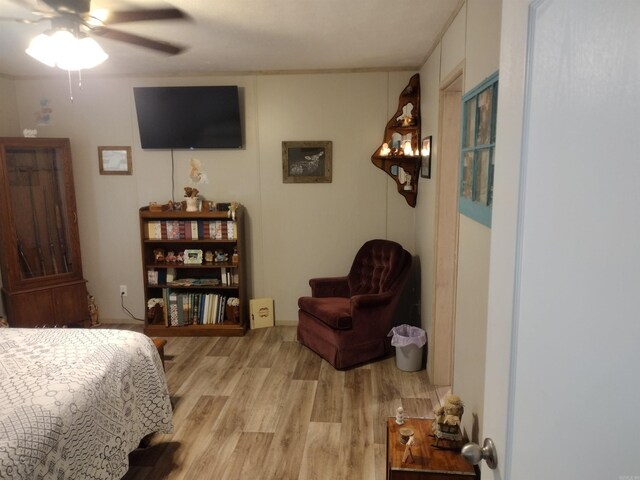 bedroom with ceiling fan and light wood-type flooring