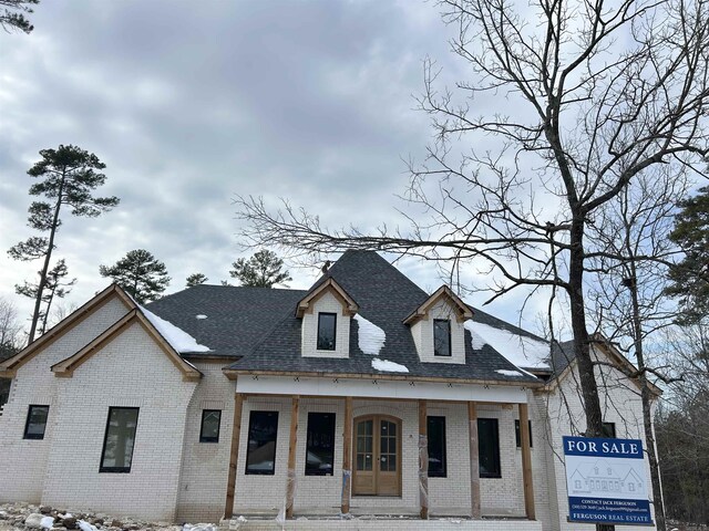 property under construction featuring covered porch