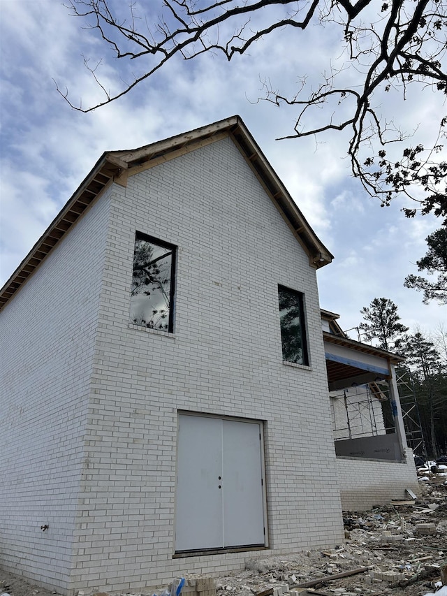 view of property exterior with brick siding