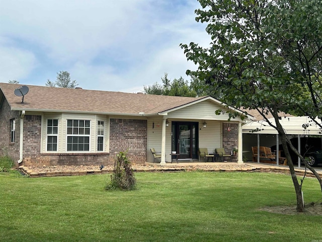 single story home featuring a front yard and a patio area