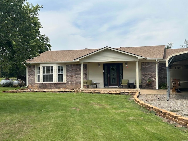 ranch-style house featuring a front lawn