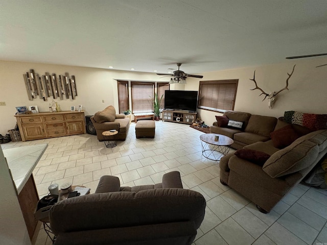 tiled living room with ceiling fan