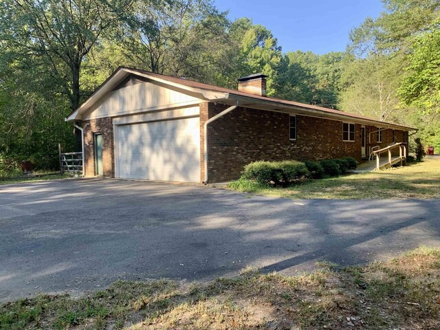 view of property exterior with a garage