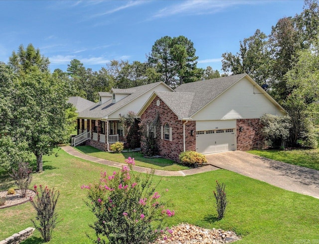 view of front of house with a front yard, a garage, and covered porch