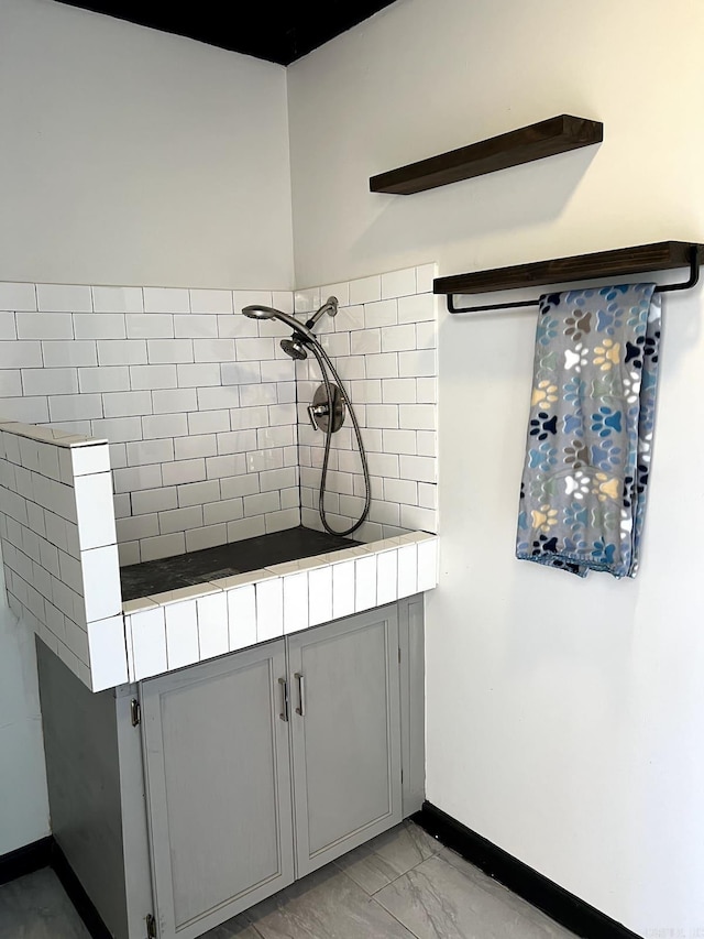 kitchen with gray cabinets and tile countertops