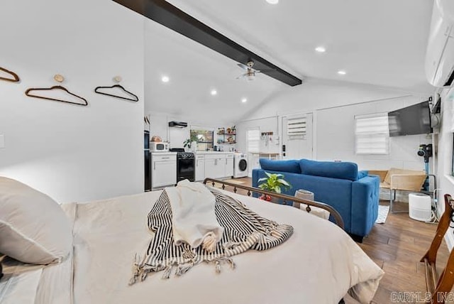 bedroom with hardwood / wood-style flooring, vaulted ceiling with beams, washer / dryer, and multiple windows