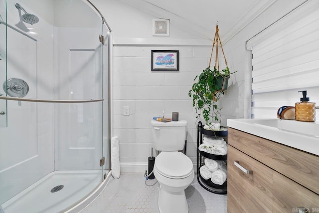 bathroom with vanity, crown molding, tile patterned floors, a shower with shower door, and toilet