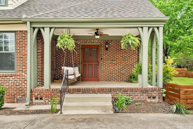 view of exterior entry with ceiling fan