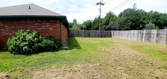 view of yard with a fenced backyard