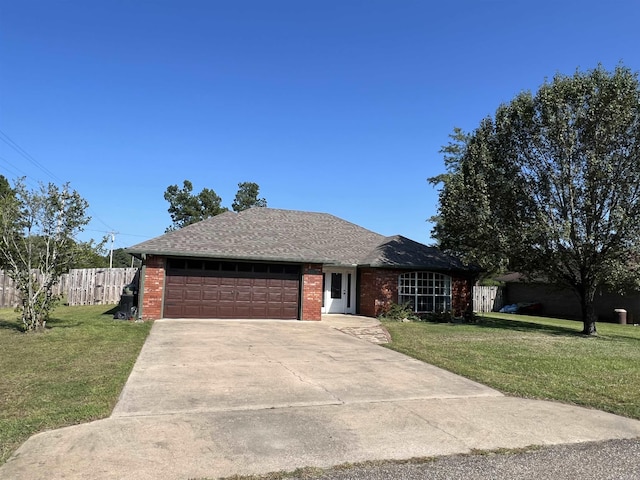 ranch-style house featuring an attached garage, brick siding, concrete driveway, and a front yard