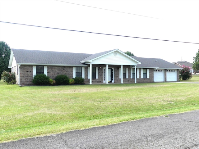 1105 Crescent Dr, Mena, AR 71953 - view of front of home with a garage, brick siding, a front lawn, a porch, and driveway