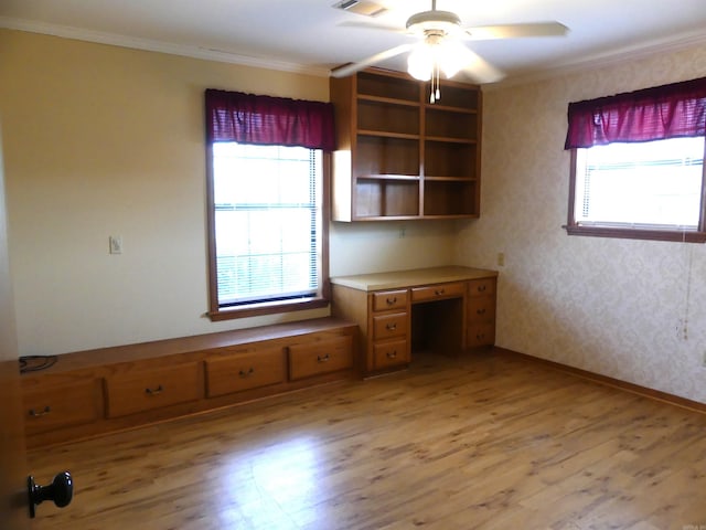 interior space featuring ceiling fan, ornamental molding, and light wood-type flooring