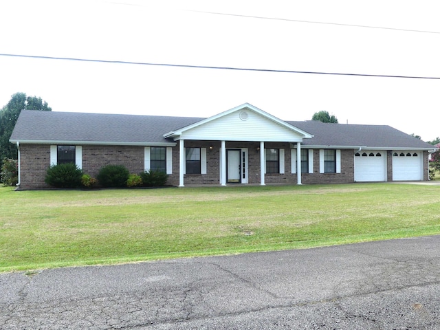 1105 Crescent Dr, Mena, AR 71953 - ranch-style house with a garage, covered porch, brick siding, a front lawn, and asphalt driveway