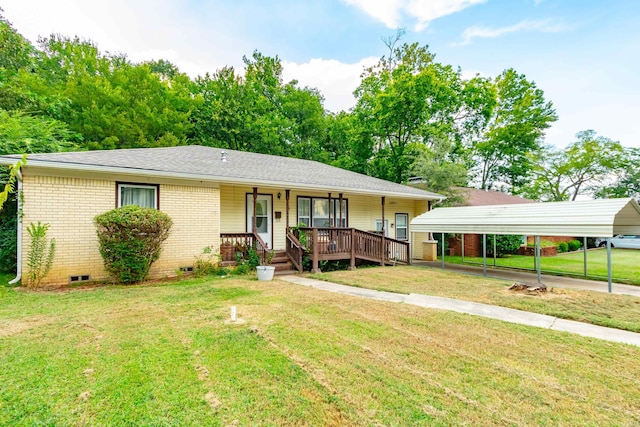 view of front of home with a front yard, a porch, and a carport