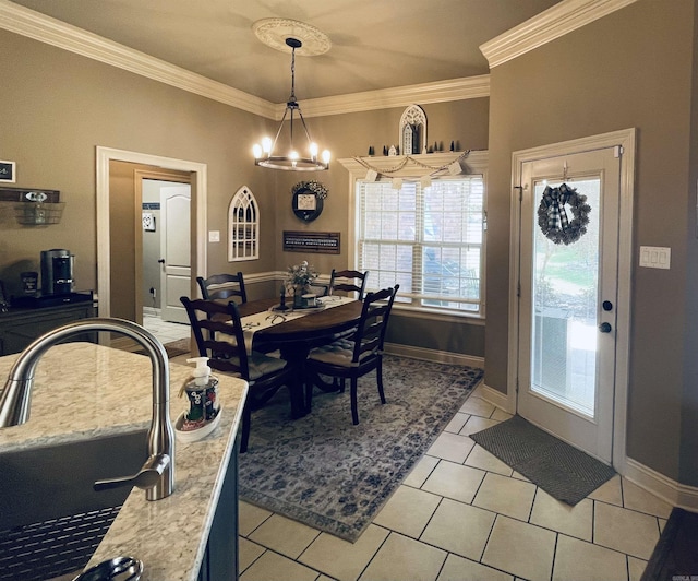 dining room featuring an inviting chandelier, baseboards, ornamental molding, and light tile patterned flooring