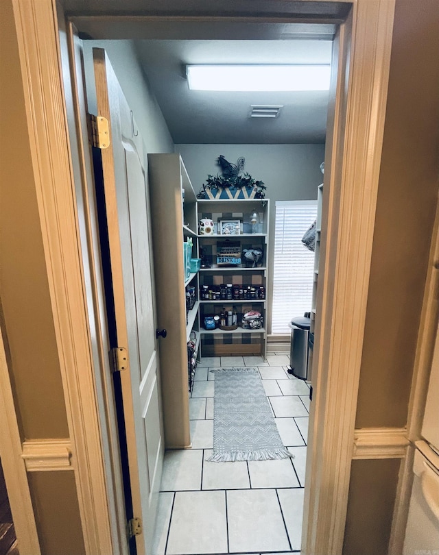 walk in closet featuring light tile patterned flooring and visible vents