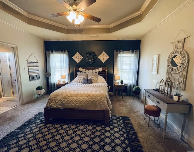 bedroom featuring carpet, a tray ceiling, and ornamental molding