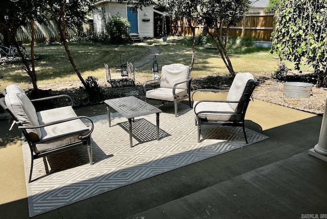 view of patio featuring entry steps and fence