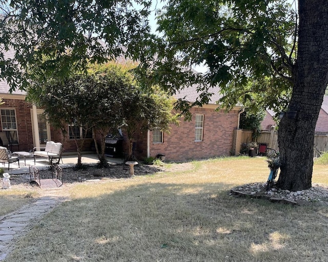 view of yard with a patio area and fence