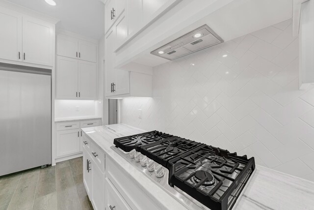 kitchen featuring light brown cabinetry and a center island