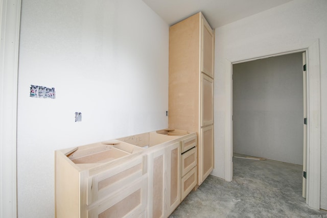 bathroom featuring concrete flooring