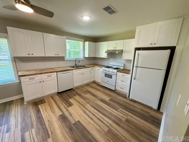 kitchen with ceiling fan, white cabinetry, hardwood / wood-style floors, and white appliances