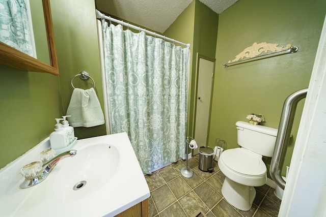 bathroom featuring tile patterned floors, a textured ceiling, vanity, curtained shower, and toilet