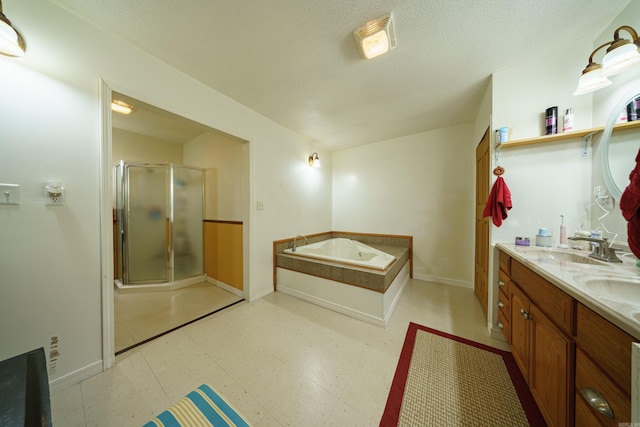 bathroom featuring shower with separate bathtub, a textured ceiling, tile patterned flooring, and vanity