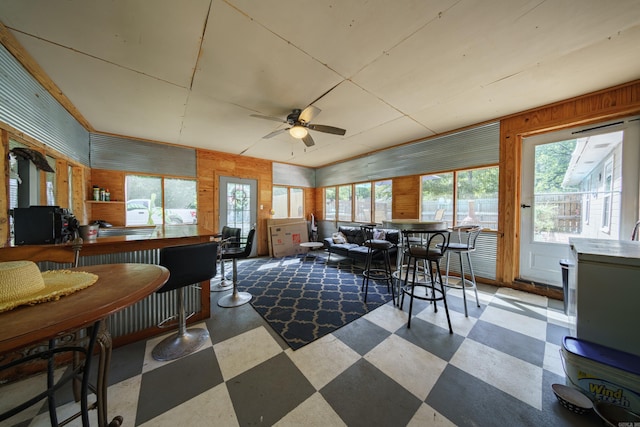 sunroom featuring ceiling fan