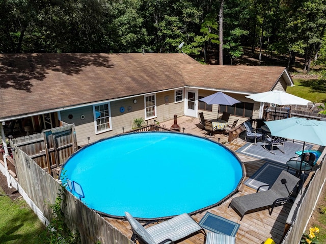 view of pool with a wooden deck