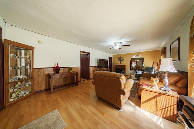 living room with ceiling fan and light hardwood / wood-style floors