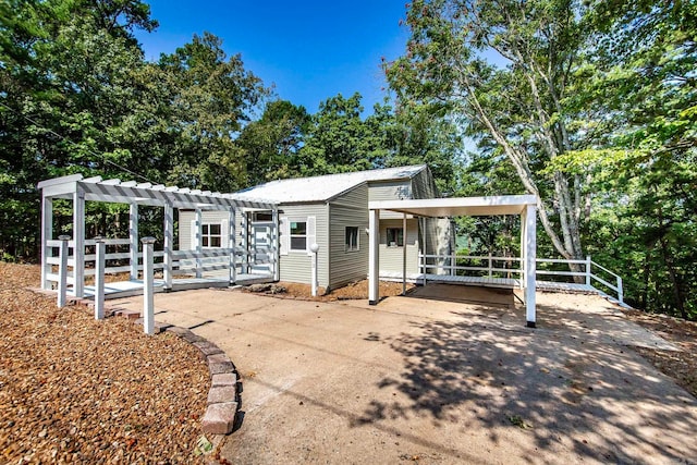 view of front of home with a pergola