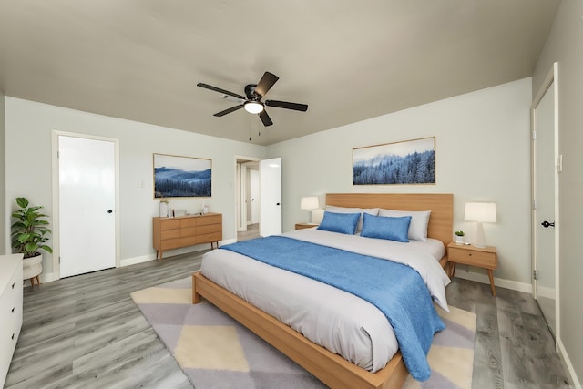 bedroom featuring hardwood / wood-style flooring and ceiling fan