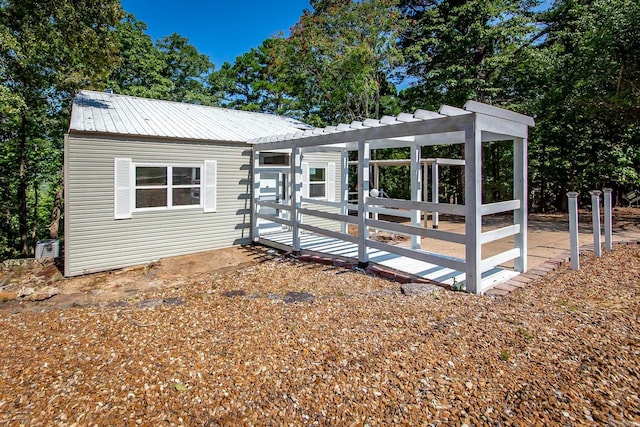 view of front of home with a pergola and a deck