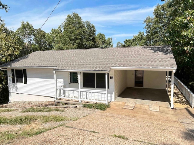 single story home featuring a carport