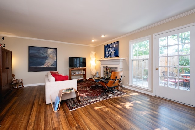 living room with dark wood-type flooring and ornamental molding